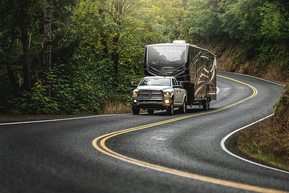 Keystone Montana fifth wheel being towed on a winding road effortlessly